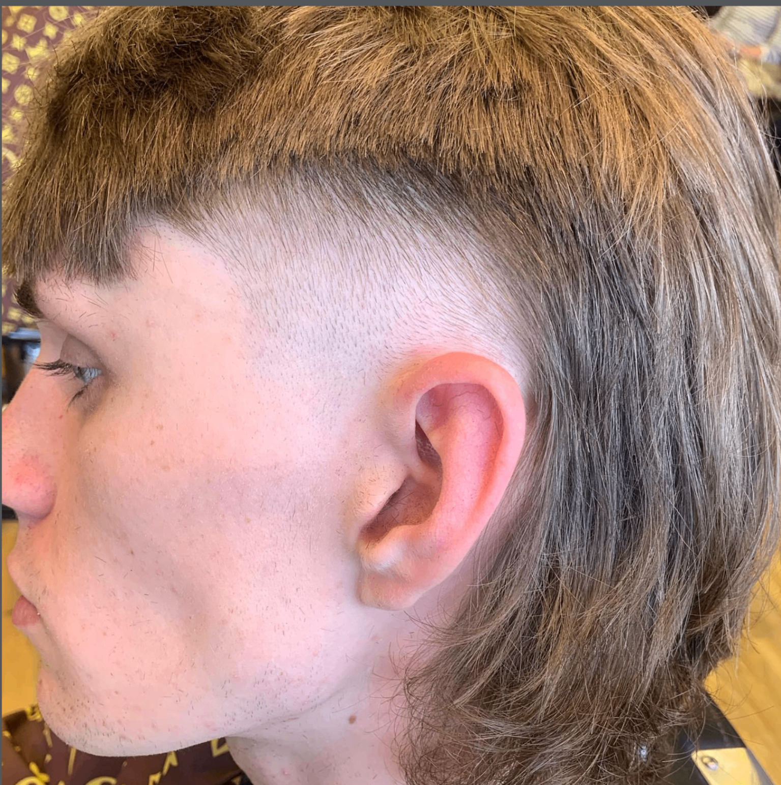 Modern mullet skin fade haircut at Ozzy's Traditional Barbers
